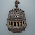 Ornate Hanging Metal Stove With Intricate Openwork Design And Flame Light