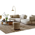 L Shaped Beige Sofa Coffee Table Set With Round Brass Legs Cushions And Floor Lamp