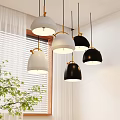 Modern Black And White Pendant Lights With Golden Hooks Near White Blinds And Green Plant