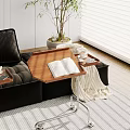 Wooden Side Table With Metal Stand By Black Sofa With Open Book Coffee Cup Tray