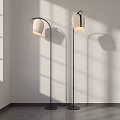 Modern Floor Lamp Design With White Lampshade Black Metal Stand And Soft Shadow Effects