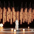 Interactive Area With Traditional Costume Statue Hanging Illuminated Text Panels And Circular Lights
