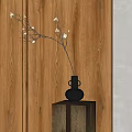 Minimalist Black Vase With White Flowers On Carved Wooden Pedestal Against Wooden Wall