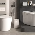 Modern White Toilets In Contemporary Bathroom With Trash Bin Shelf Towels And Toiletries
