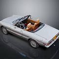 Silver Vintage Convertible Car With Tan Leather Seats And Sleek Body Design
