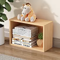 Light Wood Bookshelf With Stuffed Giraffe Toy Stacked Books And Small Potted Plant