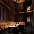 Luxury KTV Lounge Interior With Brown Leather Sofas Wooden Panel Walls And Ambient Lighting