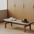 Minimalist Wooden Coffee Table With Books And Hat Near Window And Cabinets