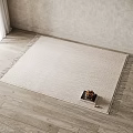 Square Woven Beige Rug With Tassel Edges And Small Tray Of Nuts On Wooden Floor