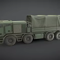 Green Military Truck With Canvas Covered Cargo Bed And Six Wheels