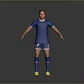 Man in Blue Soccer Jersey and Blue Shorts Standing on Gray Background with Yellow Shoes