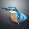 Blue And Orange Kingfisher Ceramic Figurine With Glossy Finish On Dark Background