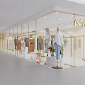 Belllettier Clothing Store With Hanging Clothes On Gold Racks And Modern Interior