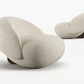 Cream Colored Rounded Sofa And Coffee Table Set With Curved Design And Dark Wooden Legs