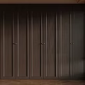 Modern Dark Wood Wardrobe Design With Multiple Paneled Doors And Metal Handles In Elegant Room
