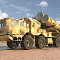 Camouflage Multi Wheeled Military Functional Vehicle With Missile Launchers On Desert Terrain