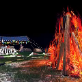 Night Garden Landscape with Illuminated Pathways Volcano Fire Pit Stones and Tent with String Lights