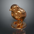 Golden Baby Chick Sculpture With Metallic Sheen On Circular Base Dark Background