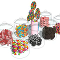Pink Cup With Lollipops And Transparent Glass Jars Filled With Various Candies