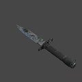 Tactical Military Knife With Worn Metal Blade And Black Textured Handle Isolated On Gray Background