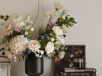Beautiful Flower Arrangement In Black Vase With Books And Photo Frame 3d model