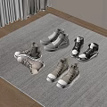 Various Stylish Shoes High Top Low Top In Neutral Gray Beige Black Tones On Carpet