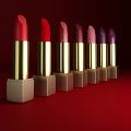 Elegant Cosmetics Lipsticks With Various Colors Golden Cases On Red Background