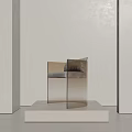 Transparent Leisure Chair with Gray Cushion on White Platform Against Light Colored Wall