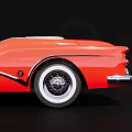 Red Vintage Convertible Car With Classic Chrome Grille And White Wall Tires