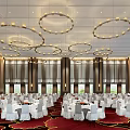 Elegant Banquet Hall With Hanging Chandeliers Large Screen And White Tablecloth Tables On Red Carpet