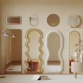 Various Shaped Mirrors on Beige Wall with Decorative Table and Floor Lamp