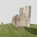 Ancient Castle Ruins Architecture With Tall Ruined Stone Brick Walls On Green Grassland
