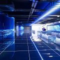 Modern Hi tech Exhibition Hall With LED Screens Futuristic Lighting Circular Platform And Digital Backdrop