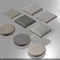 Assorted Fabric Cushions In Various Shapes With Textured And Plain Design Patterns