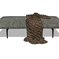 Modern Gray Sofa Bench With Textured Fabric Black Metal Legs And Brown Blanket Draped
