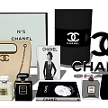 Chanel Bag And Box Collection With CC Logo Perfume Bottles And Coco Chanel Poster