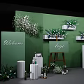 Elegant Photo Check-in Spot With Green Wall Flower Arrangements Easel Logo And White Pillars