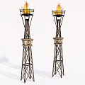 Tall Ancient Architectural Torch Towers With Flames And Traditional Decorative Design