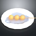 Three Yellow Balls Skewered On Bamboo Stick Served On White Plate With White Sauce