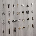 Various Metal Cabinet Handles in Different Designs Displayed on Wooden Panel