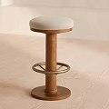 Wooden Bar Stool With Beige Padded Seat And Spiral Base Metal Footrest Ring