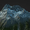 Scenic Snowy Mountain With Rocky Peaks And Lush Green Vegetation