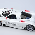 White Nissan High Performance Race Car With Aerodynamic Design And Red Rear Wing