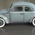 Light Blue Vintage Beetle Car With Curved Body And White Wall Tires