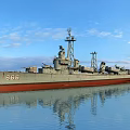 Warship 868 Gray Hull Red Bottom Floating On Calm Water Under Blue Sky With Clouds