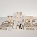 Elegant Jewelry Display With Necklaces Bracelets Rings And Earrings Arranged On Stands