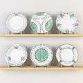 Ceramic Plates Featuring Decorative Blue Green Patterns On Wooden Shelves