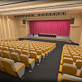Large Conference Room With Yellow Seats Neatly Arranged Red Curtain And Wooden Walls