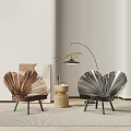 Brown and Silver Shell Shaped Chairs with Black Legs and Round Wooden Side Table