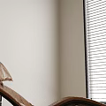 Brown Leather Lounge Chair With Metal Frame On Wooden Floor Near Green Plant